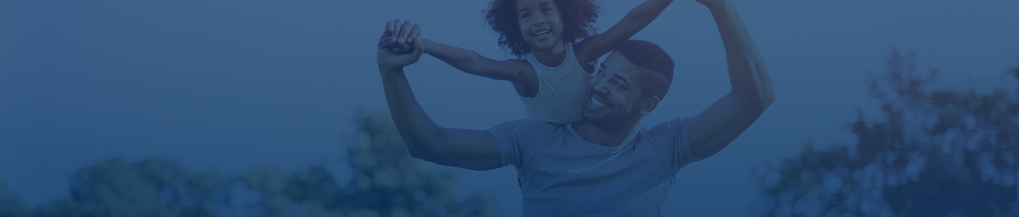 Child flying on father shoulders